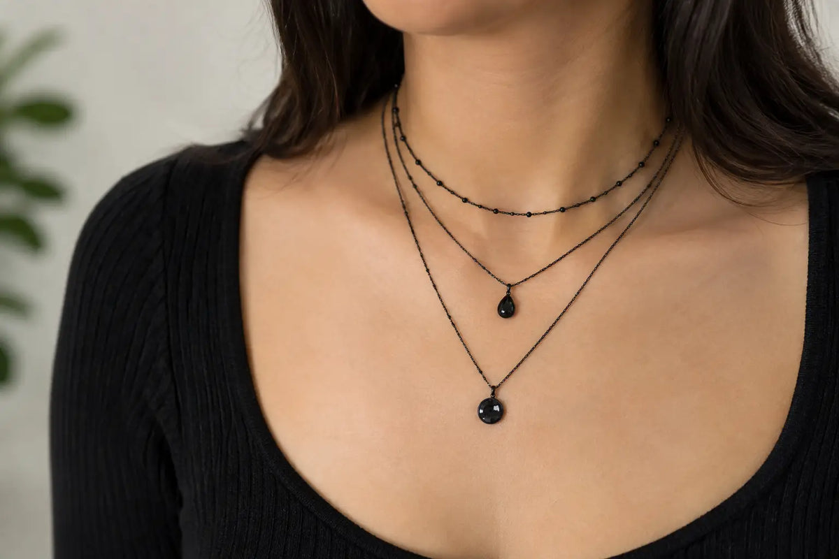 How to Layer Black Necklaces Without Looking Busy